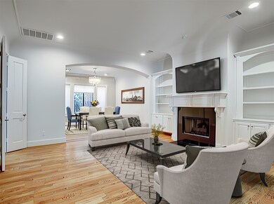 LIVING ROOM - (17 x 16) Oak flooring with inlaid walnut accents adds warmth to the living/dining area. (Photo is virtually staged.)
