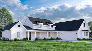 Modern farmhouse featuring a front yard, a large c