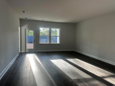 Spare room with dark hardwood / wood-style floors