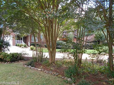 Yard/Garden. Crepe myrtles along front border of yard