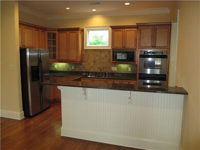 Updated kitchen with beautiful cabinetry with butl