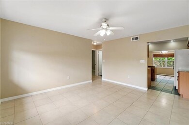 Unfurnished room with a ceiling fan, baseboards, a