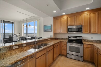 Kitchen featuring pendant lighting, a water view,