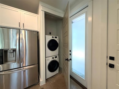 Laundry area featuring estacked washer and dryer 