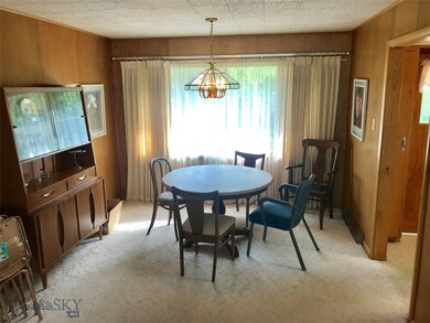 Dining room with large window to the backyard