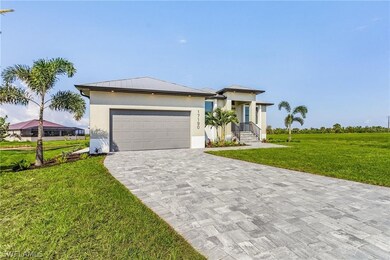View of front of home featuring a garage and a fro