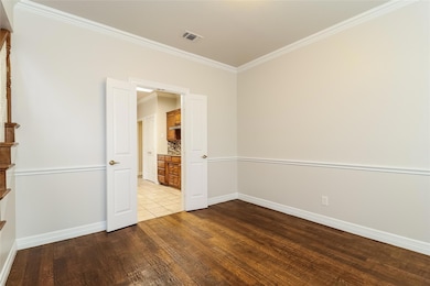 Unfurnished room featuring ornamental molding and 