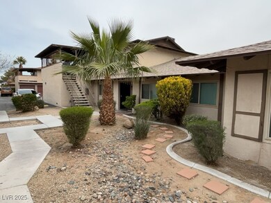 View of front facade with stucco siding, a shingle