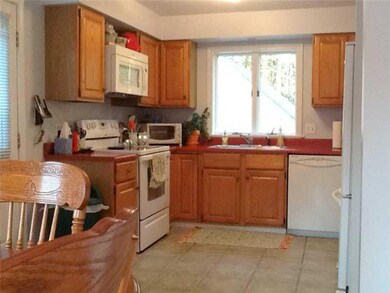 Kitchen. Oak cabinets and tiled...
