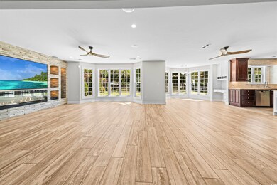 Unfurnished living room featuring visible vents, c