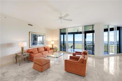 Living room featuring crown molding, floor to ceil