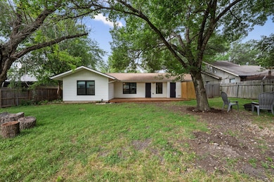 Back of property featuring a deck