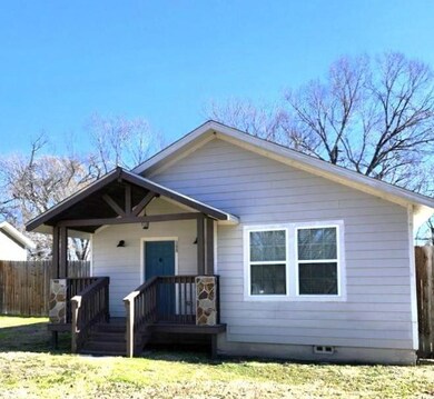 Bungalow-style house with a front lawn