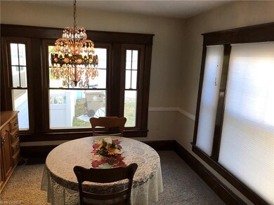 Formal dining room with large windows for natural 