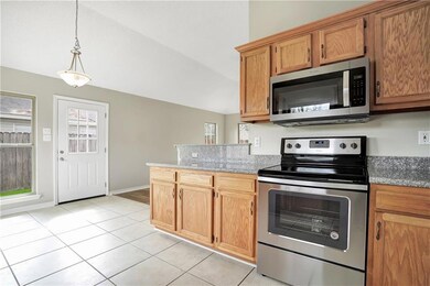Kitchen with new granite counter tops and new stai