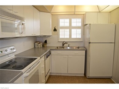 Kitchen with cork flooring and corian counter tops