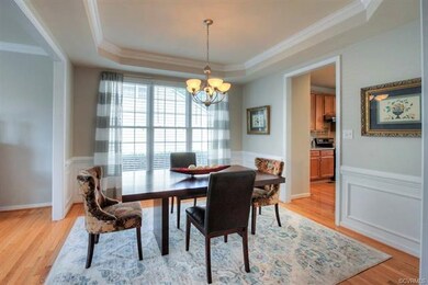 Dining Room w/ extensive molding and tray ceiling