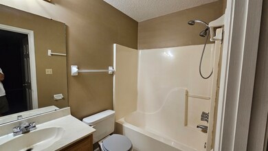 Full bathroom with vanity, toilet, bathing tub / s