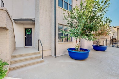 Entrance to property featuring brick siding