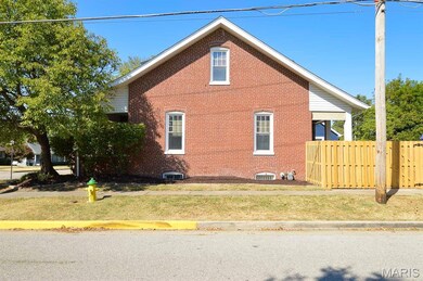 View of side of home with brick siding