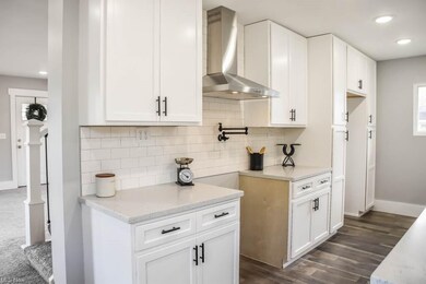 Subway tile backsplash and a pot filler.