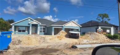 Single story home featuring a garage, dirt drivewa