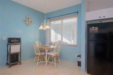 Tiled dining area with a notable chandelier