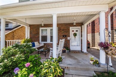 This lovely front porch welcomes your family and f