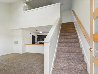Stairway featuring carpet flooring
