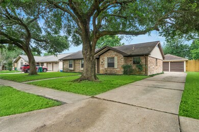 2210 Willow Blvd - has detached garage with long driveway.