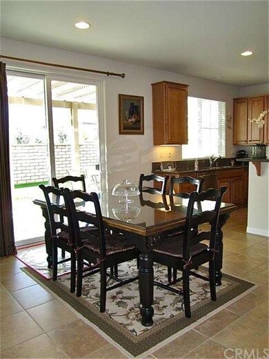 Breakfast area overlooks covered patio