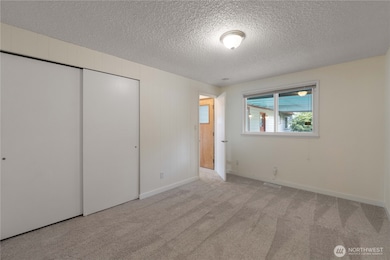 Here is your spacious 4th bedroom.  Located behind the family room and with easy access to the covered patio.