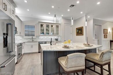 Showing glass cabinets and stainless steel appliances