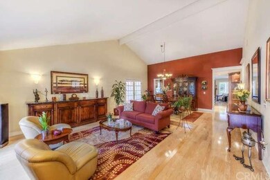 Warm and welcoming step down living room features 