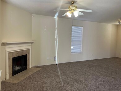 Unfurnished living room featuring ceiling fan, lig