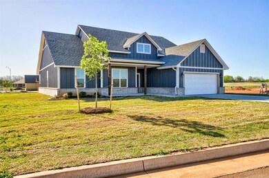 View of front facade featuring a garage and a fron