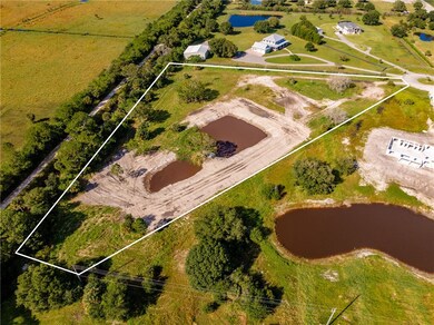 View of property location with a nearby body of water and property boundaries highlighted