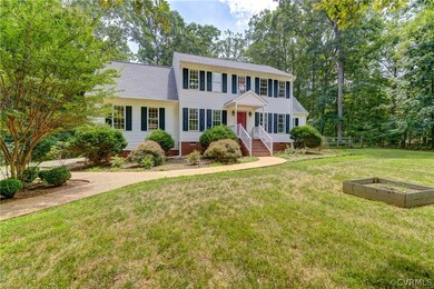 Classic Colonial in a wooded yet bright setting.