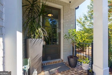 Private covered front porch feels more like Single Family than a Townhouse