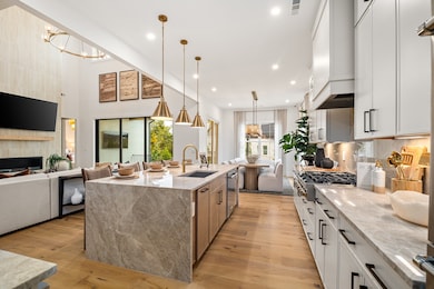 This Harpeth Model Home Kitchen/Dining/Great Room area is SPECTACULAR and will make you the ultimate hostess! So many options from flooring to countertops and cabinetry and don't forget all your small details like faucet color and style! Rep only.
