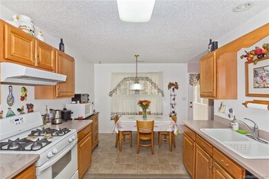 Eat-in kitchen with gas stove/oven.