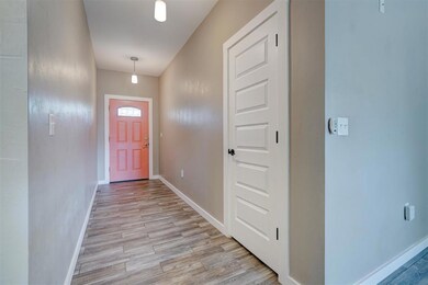 Doorway featuring light wood-type flooring
