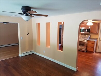 LIVING RM. VIEW OF KITCHEN AND FAMILY RM