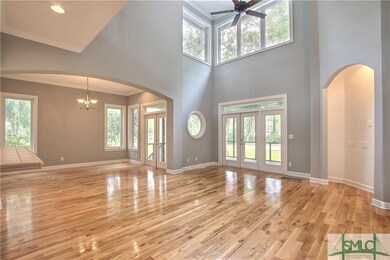 Family room is open to dining, kitchen and leads t
