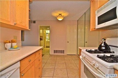 100% remodeled kitchen boasts gleaming white appli