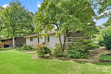 Landscaped yard with sprinkler and drip system installed at water faucet