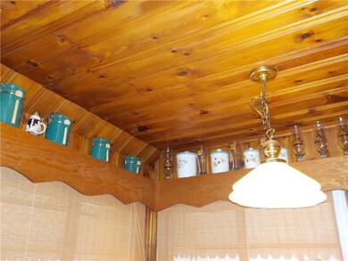 Knotty pine ceiling & shelf in dining nook