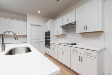 Kitchen with light hardwood / wood-style floors, s