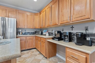 Kitchen featuring a textured ceiling, stainless st