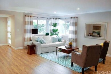 large living room with warm tone flooring, new pai